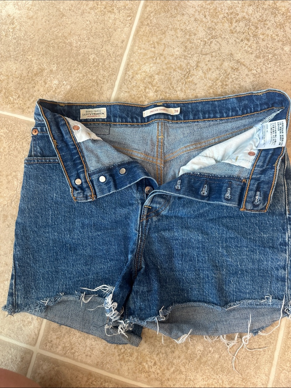 Levi's Distressed Dark Blue Denim Cutoff Shorts